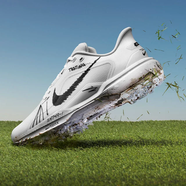 Golf shoe on grass.