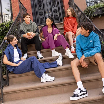 Youth hanging out on a stoop.