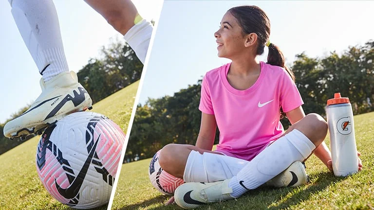 Child dribbling with a soccer ball.