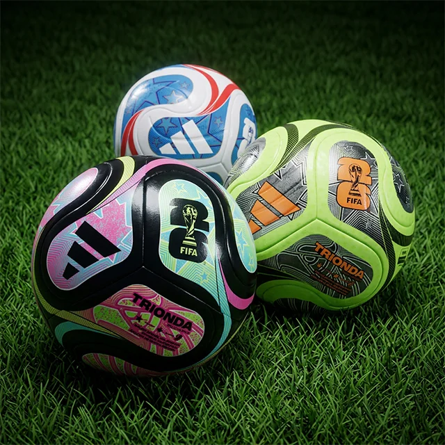 Soccer balls in grass