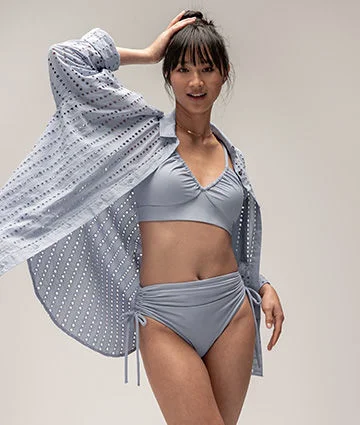A woman in CALIA swimwear.