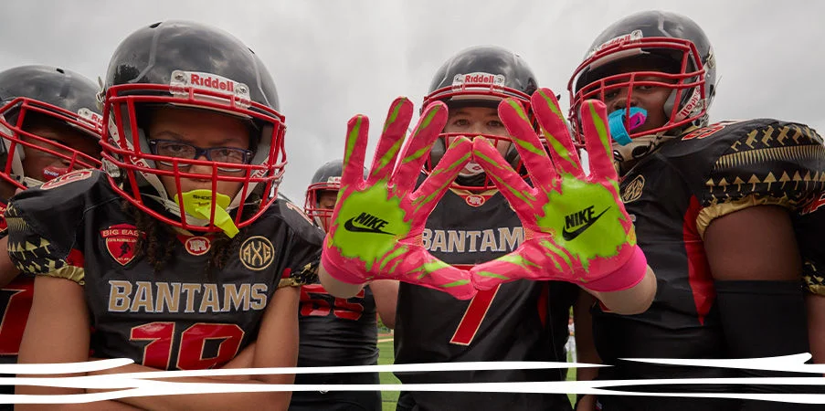 Football players posing to camera.