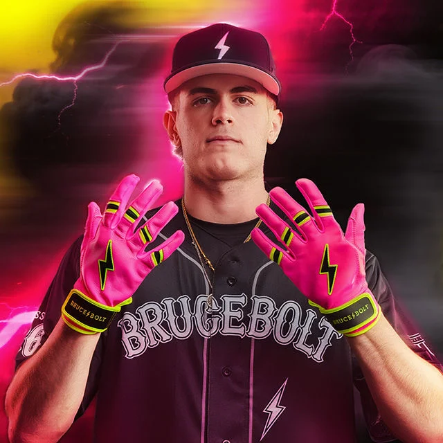 Baseball player showing off gloves.