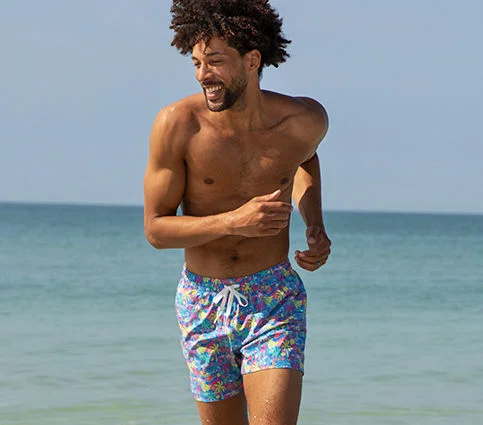 A man in swim trunks.