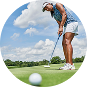 A woman putting.