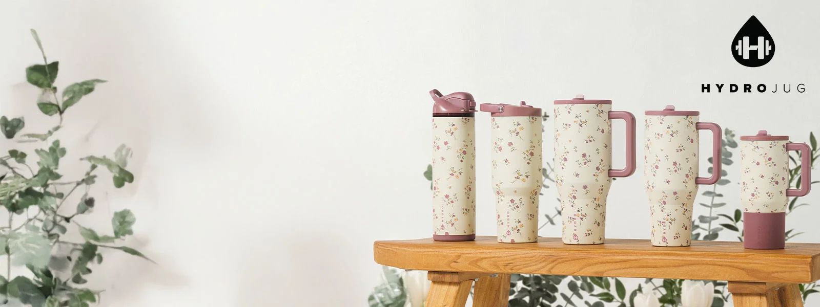 Hydrojug drinkware in floral environment.