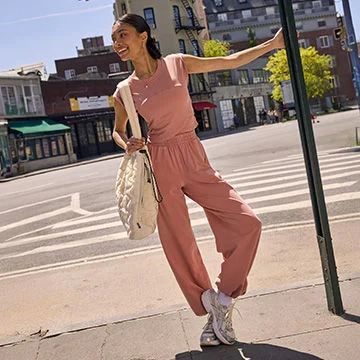 Woman in pink outfit on urban street