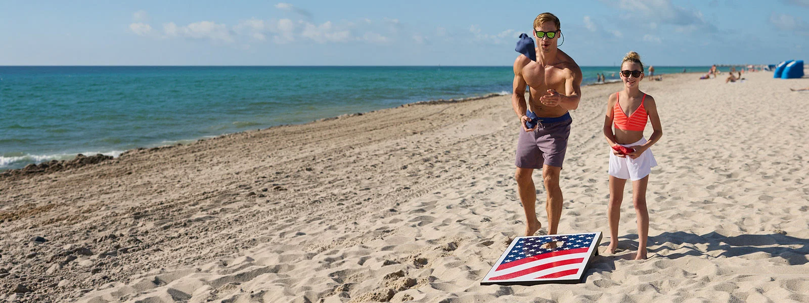 Athletes on beach.