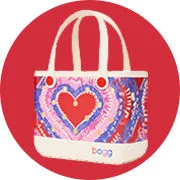 White Bogg bag with pink bow pattern. 