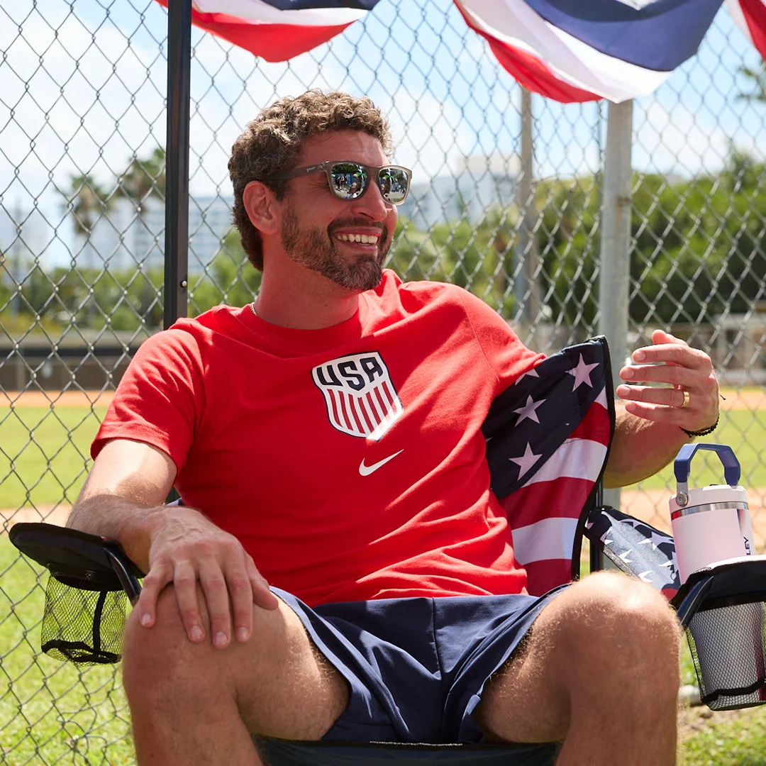 USA Soccer fan sitting outside.