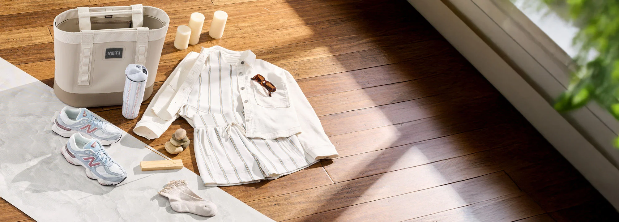 Mother's day apparel, shoes and accessoires on wood floor.