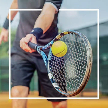 Tennis player hitting ball with racquet. 