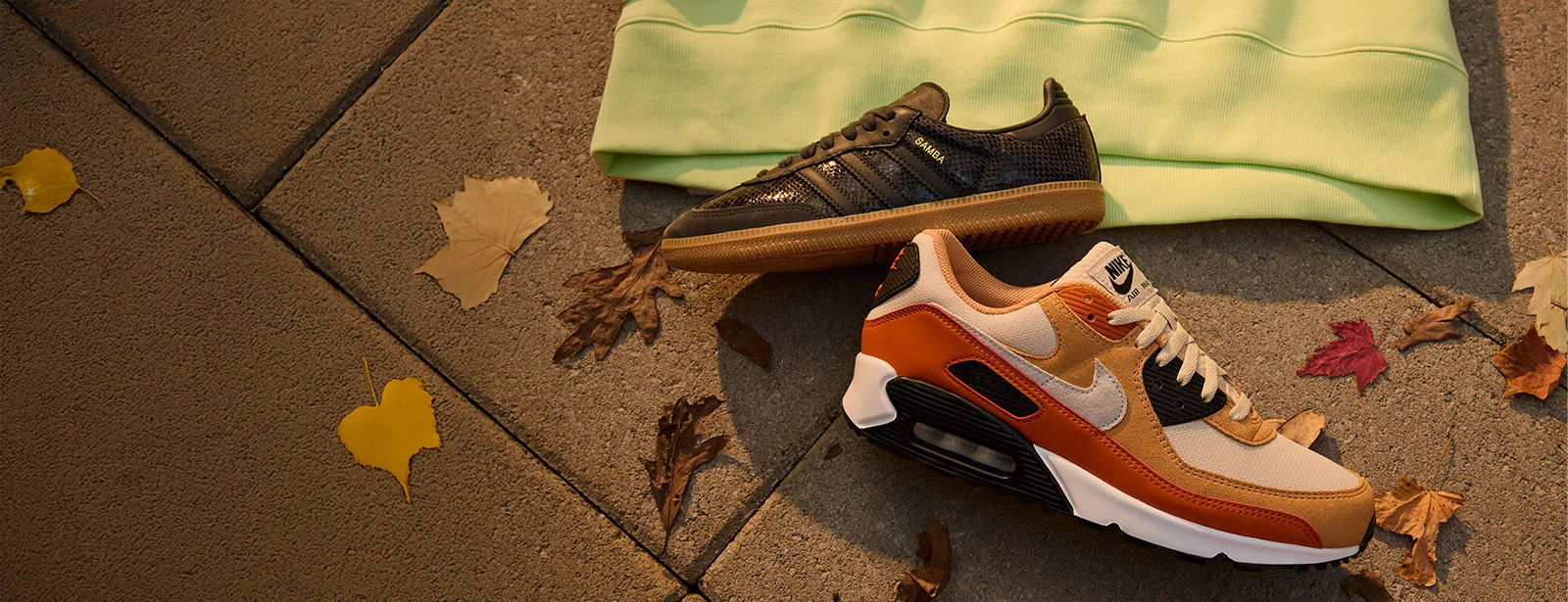 One orange and one black shoe. 