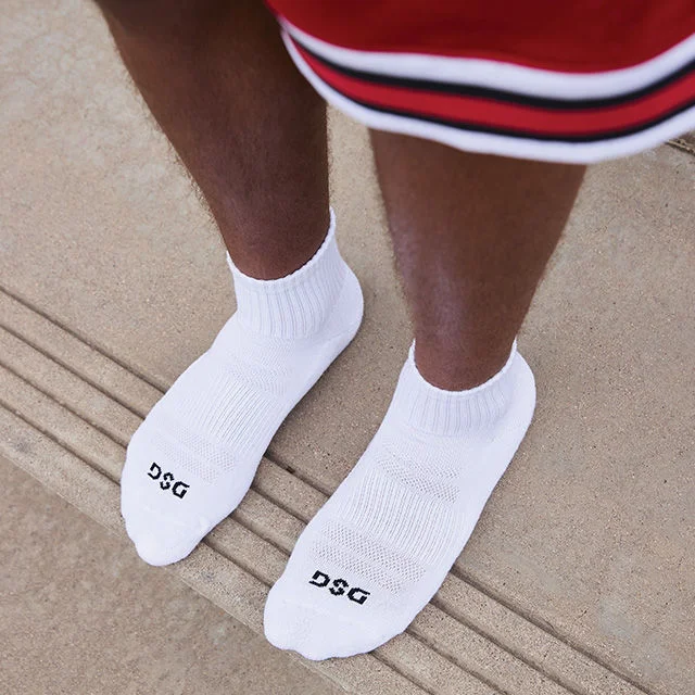 Crop in of athlete wearing white socks.
