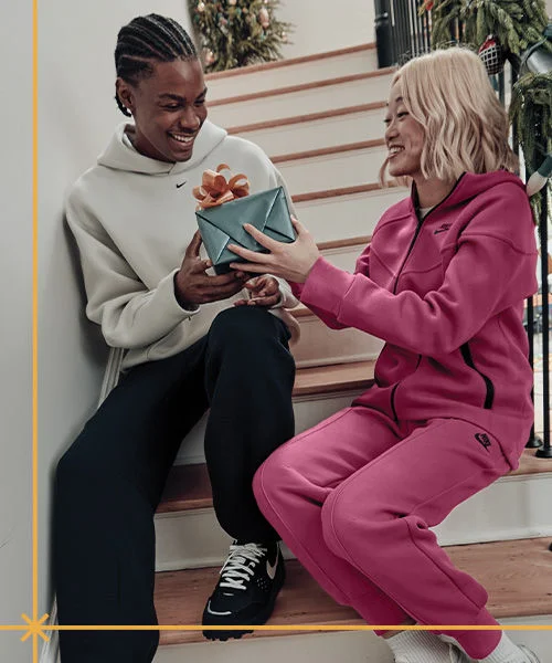 Athletes in indoor environment giving gift.