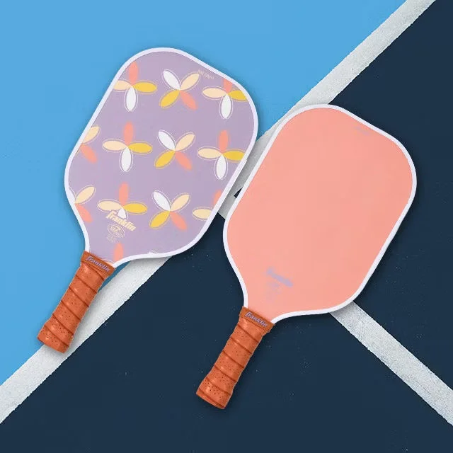 Pickleball paddles on court