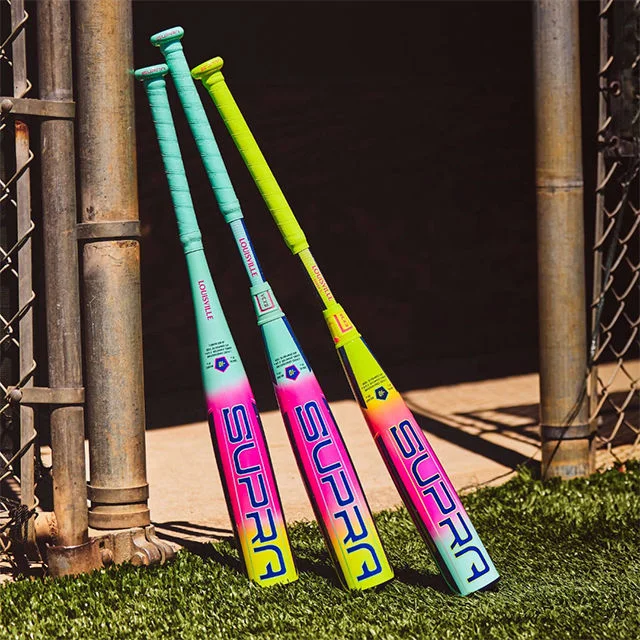 Baseball bats on baseball field background.