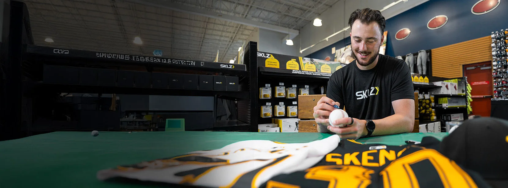 Athlete signing memorabilia. 