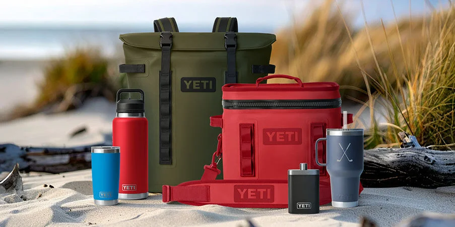 Dad carrying a Yeti cooler.
