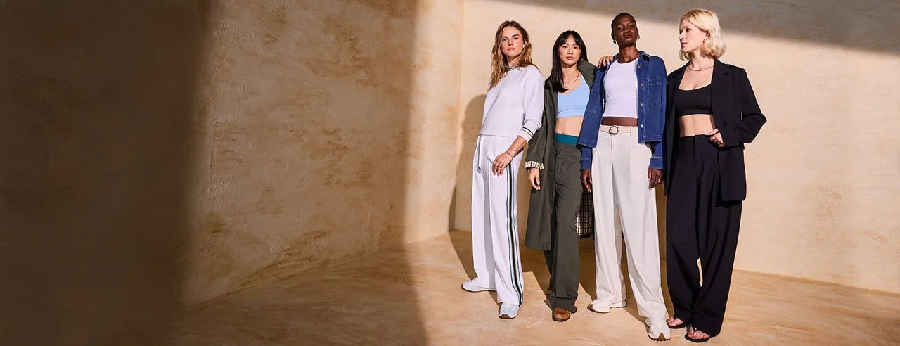 Women in new Calia outfits. 