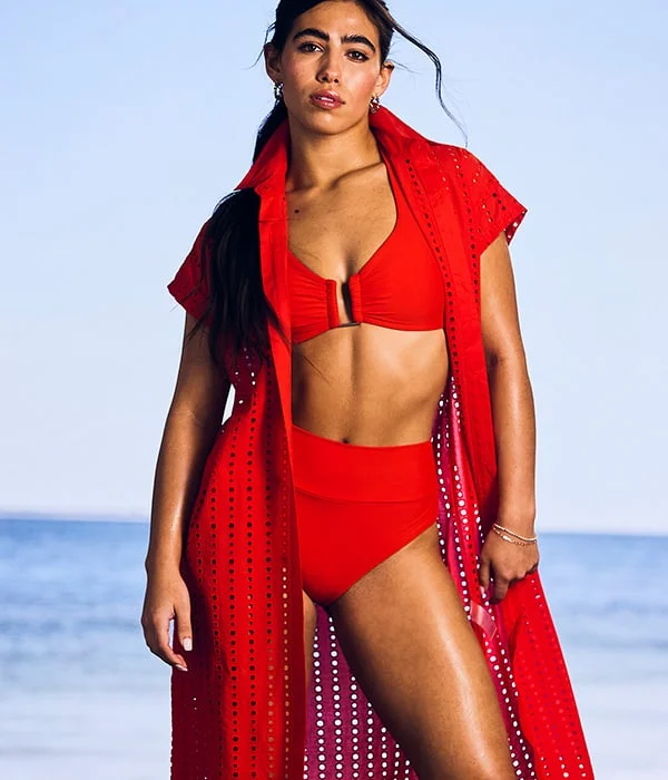 Woman in a two piece bathing suit and a cover up. 