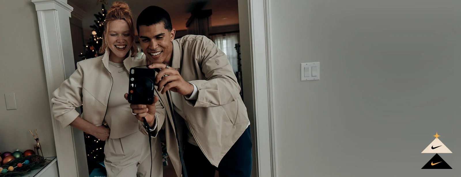 Couple in Nike 24.7 clothing collection.