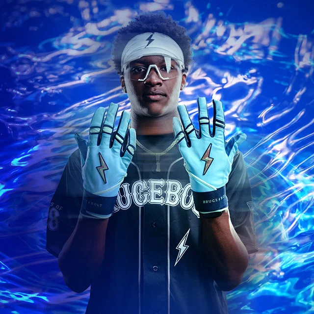 Baseball player holding out gloves.