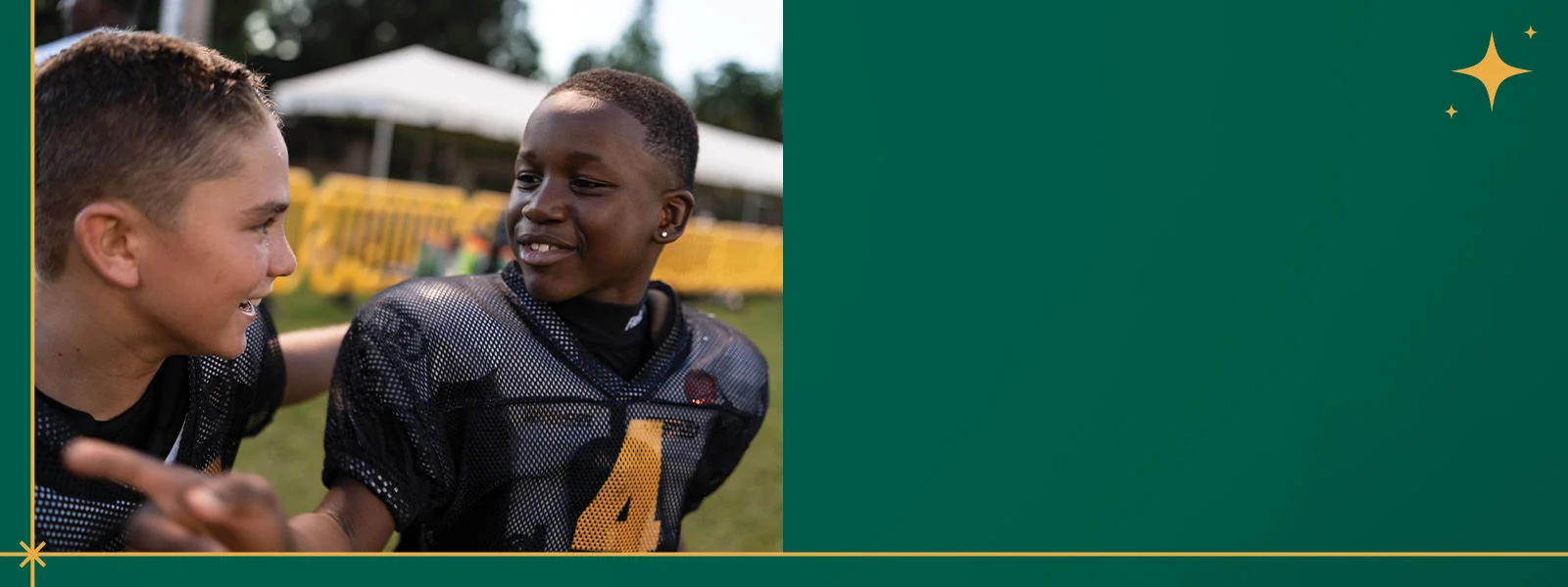 Two youth athletes talking.