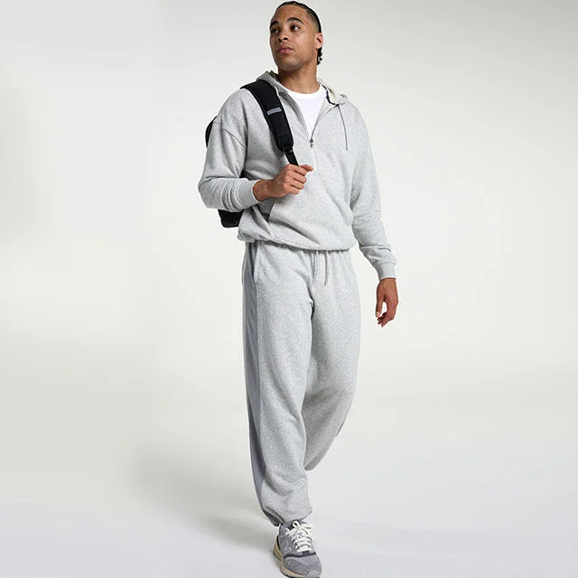 Man in a grey fleece set.