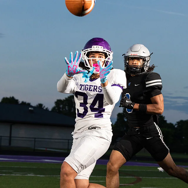 Football player catching a ball during a game.