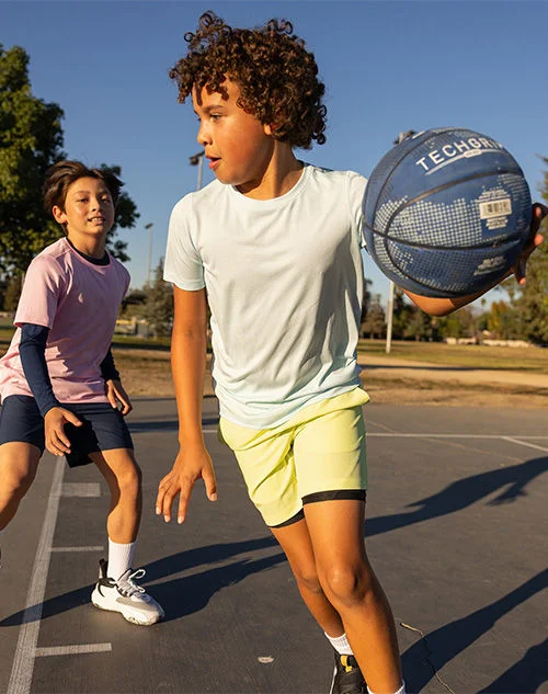 Boy playing in shorts.