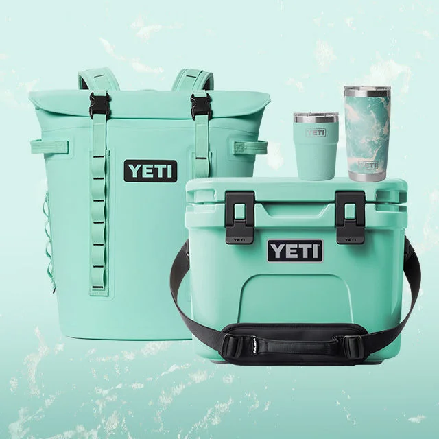 Collection of YETI gear with on a seafoam background.