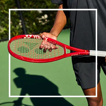 Man holding tennis racquet.