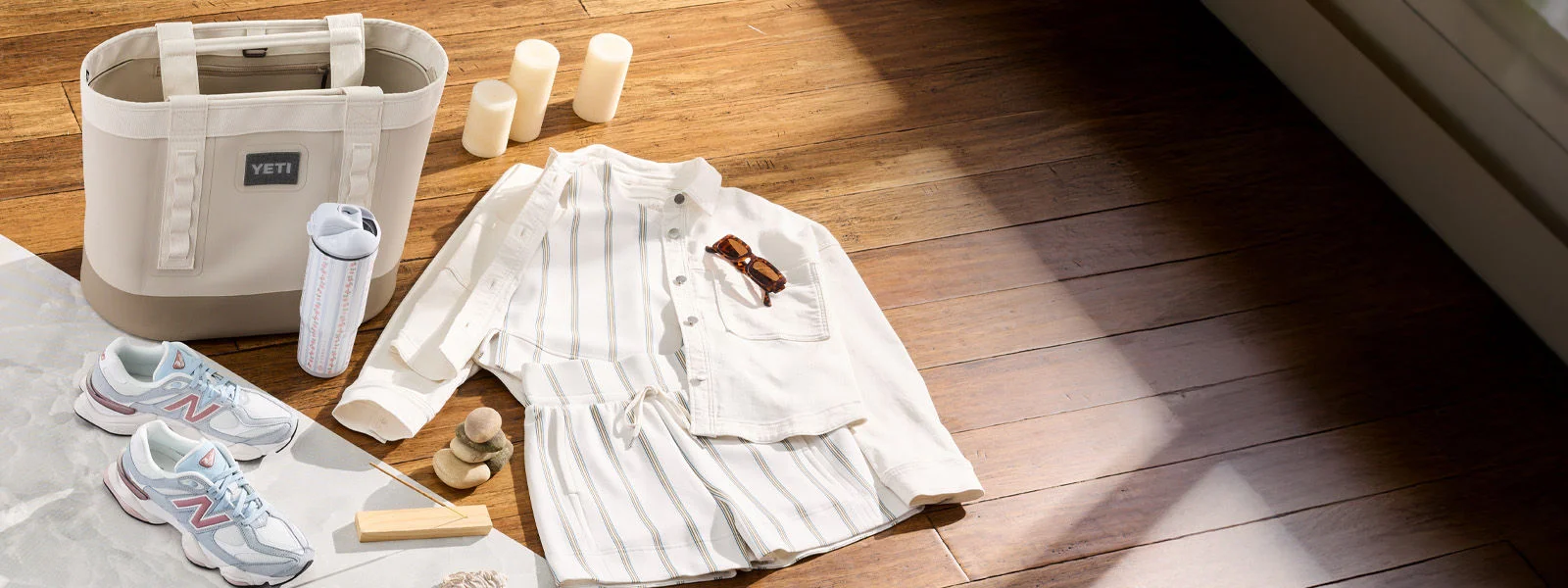 Mother's day apparel, shoes and accessoires on wood floor.