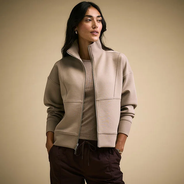 Woman wearing Calia jacket and sweat pants. 