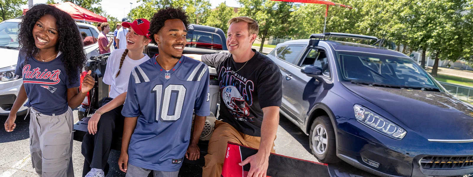 Football fans outdoors wearing licensed product.