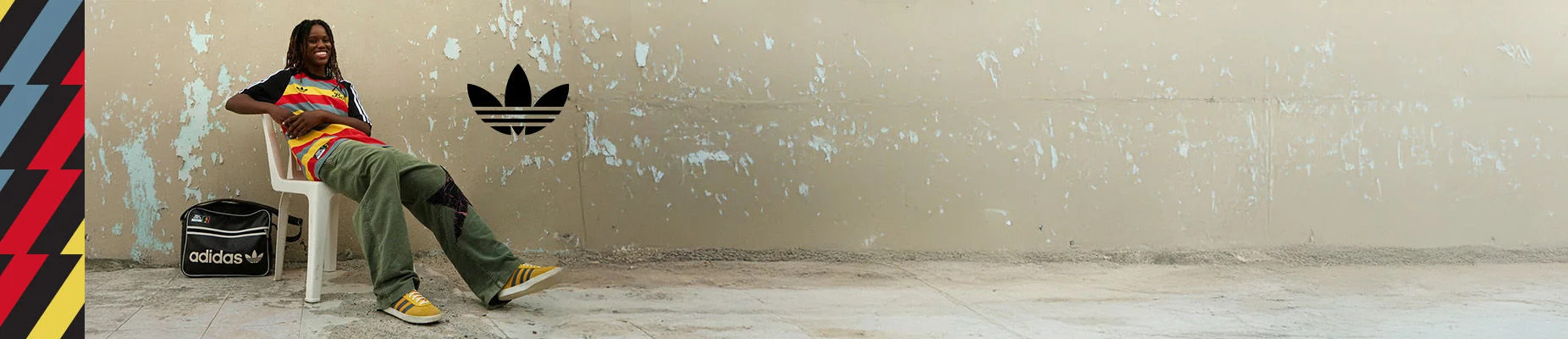 Model sitting in outdoor environment.