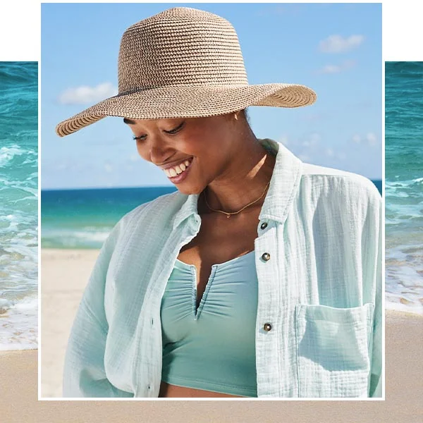 A woman wearing a beach hat.