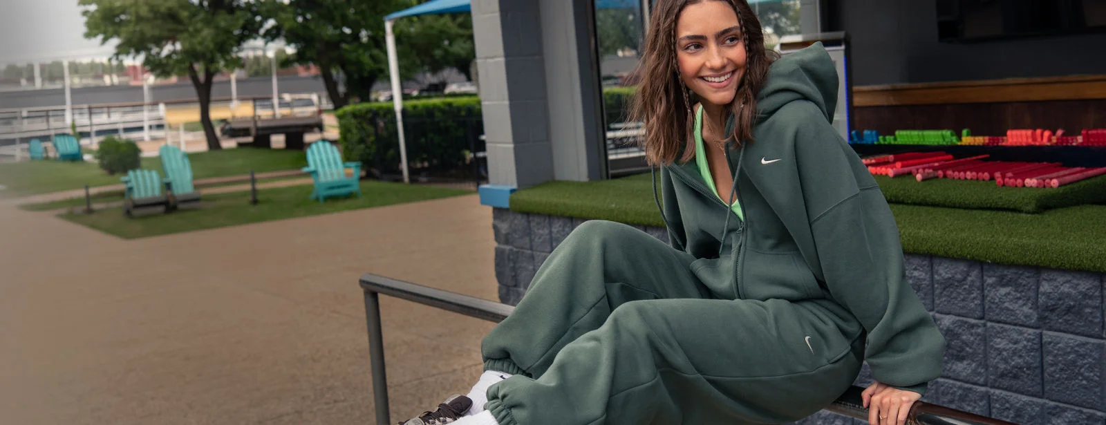 Girl sitting outside in fleece outfit. 