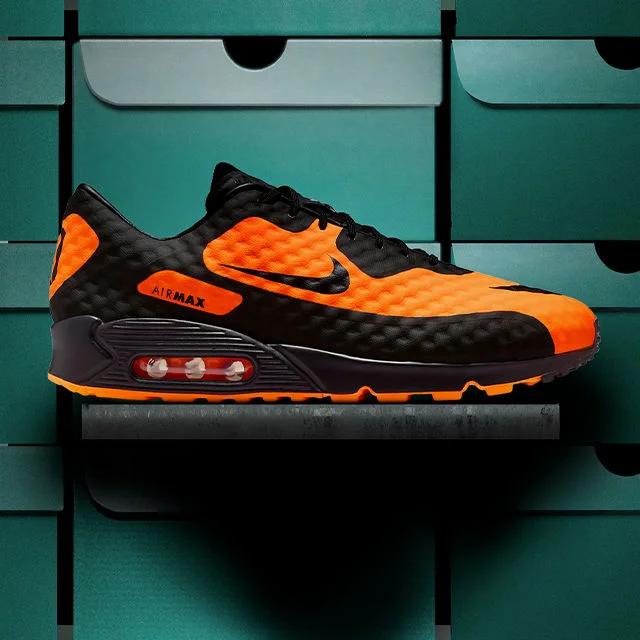Shoe in front of stacked shoe boxes.