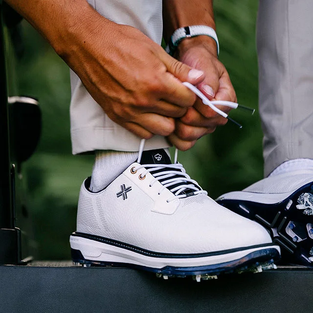 Man tying shoe laces.
