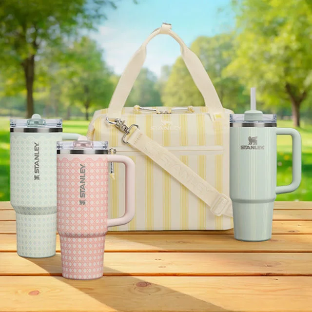 Collection of Stanley 1913 drinkware with cooler.