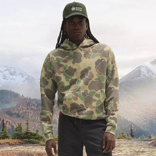 Man wearing camo apparel.