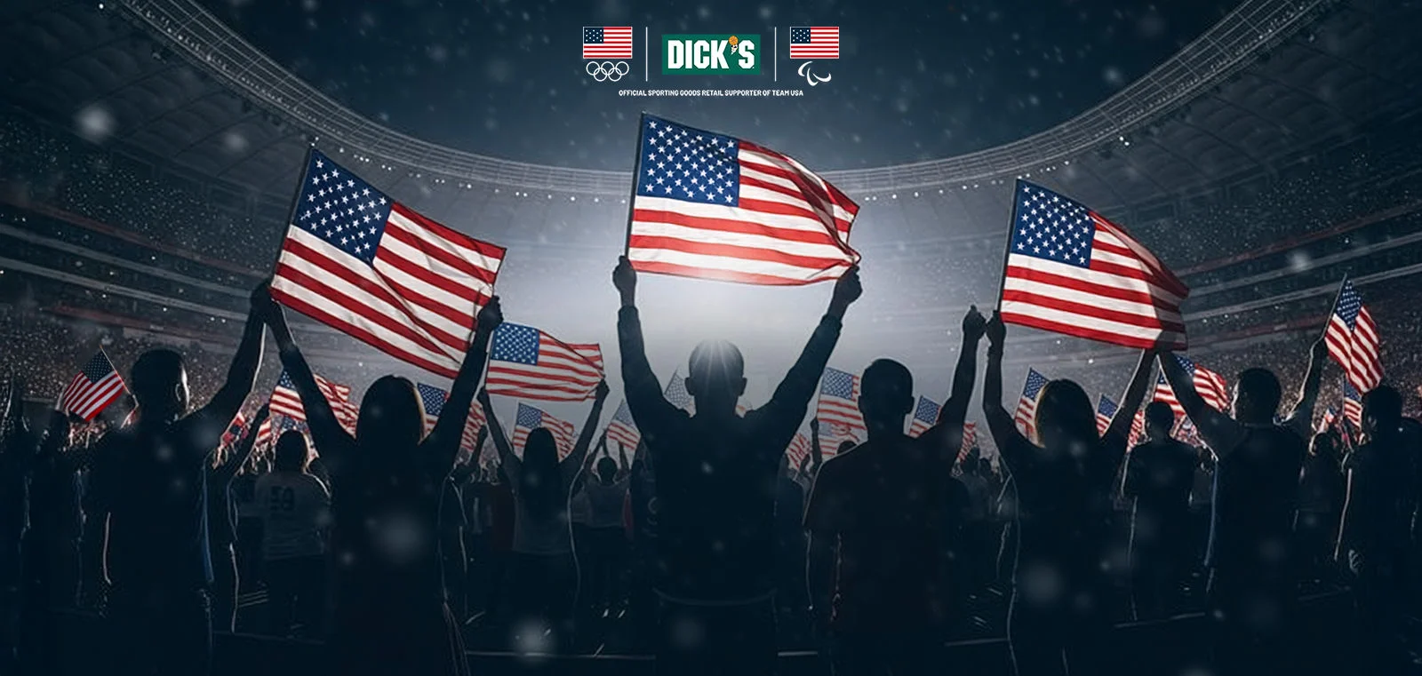 Athletes holding up American flags in an arena