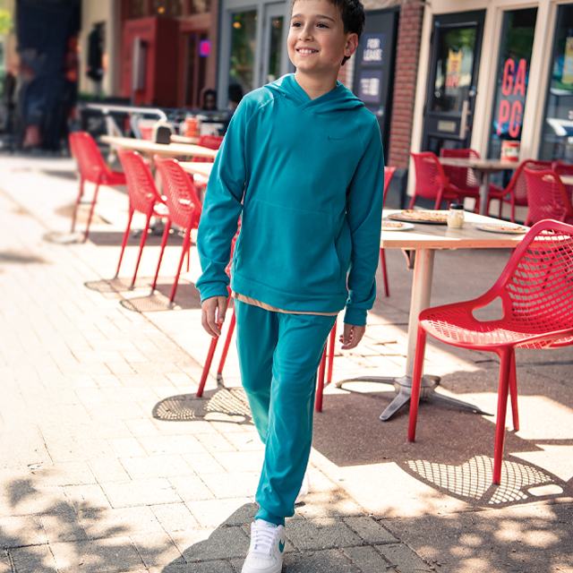 Boy in matching fleece outfit.