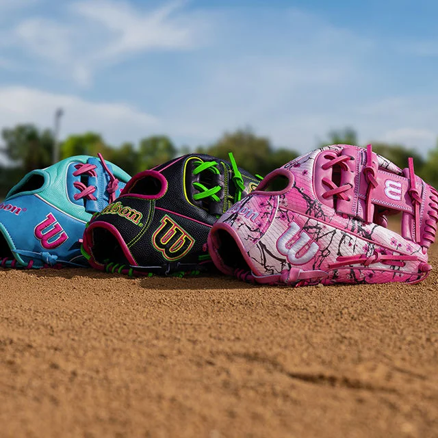 Baseball gloves on baseball field.
