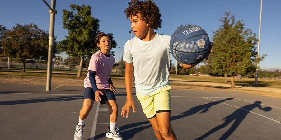 Kids playing basketball.