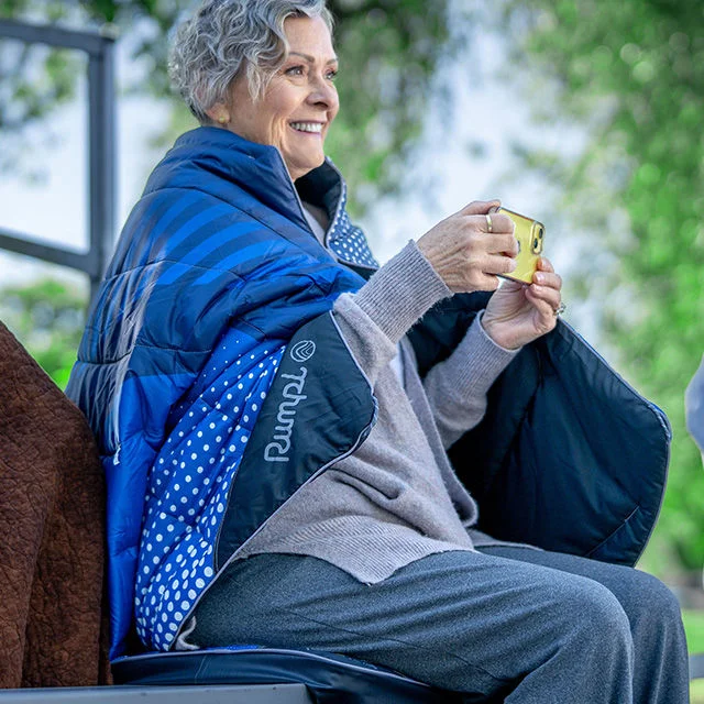 Woman in Rumpl blanket.