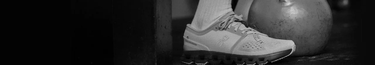 Person wearing On Shoes in a gym. 
