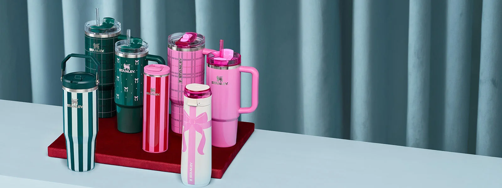 A collection of Stanley holiday themed drinkware